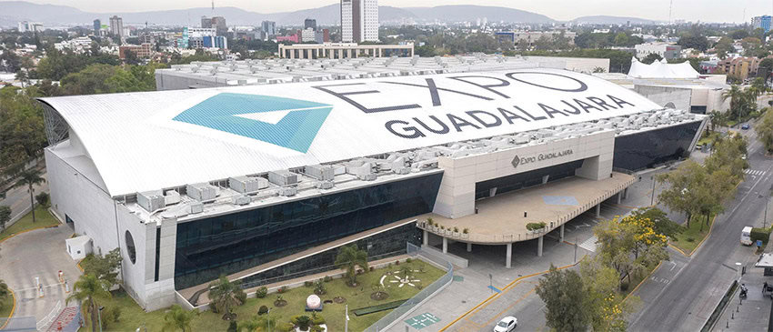An aerial view of a convention center with the words "Expo Guadalajara" written in enormous letters on its roof