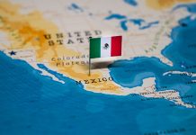 Did Mexico really ‘miss the nearshoring boom’? A perspective from our CEO A map of Mexico with a tiny Mexican flag planted on the country