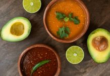 Two ceramic bowls with traditional Mexican salsas.